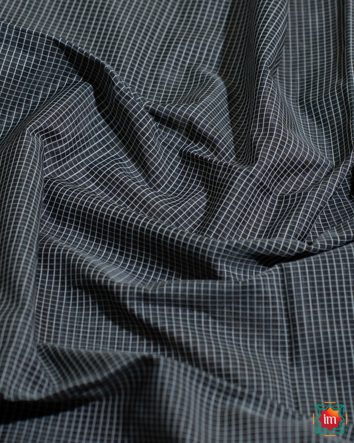Beautiful grey black silk saree, where in the detailed saree print is displayed.