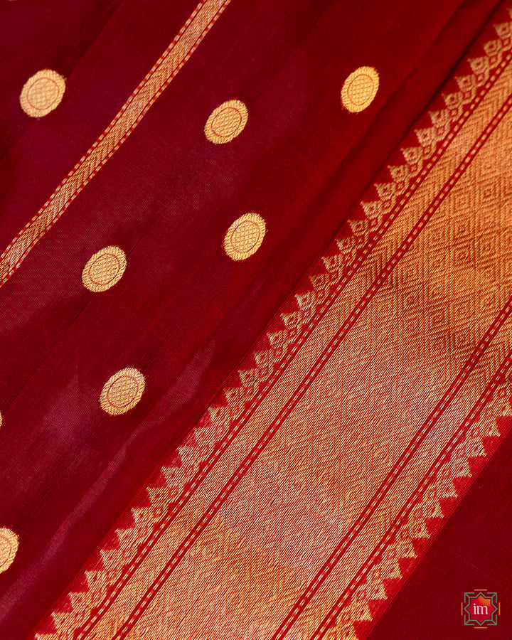 Beautiful red silk saree, where in the detailed saree print is displayed.