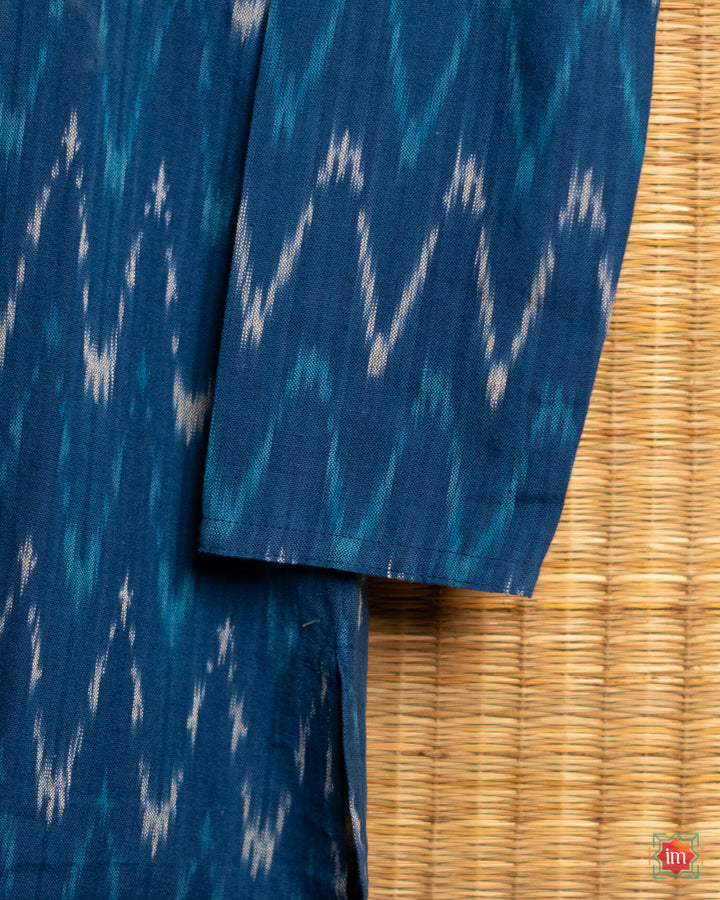 Mens blue kurta, where in the detailed shoulder side print is displayed.