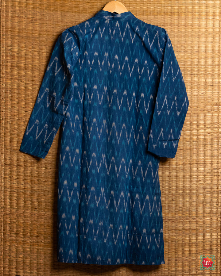 Mens blue kids hanged on a hanger with mat in the background.
