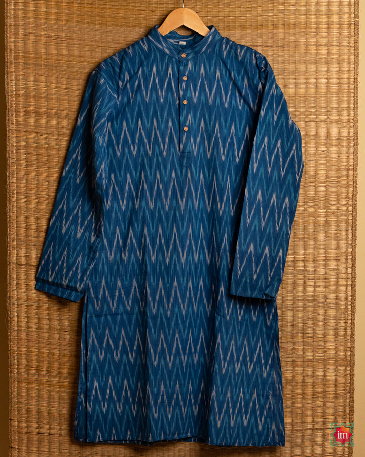 Mens blue kids hanged on a hanger with mat in the background.