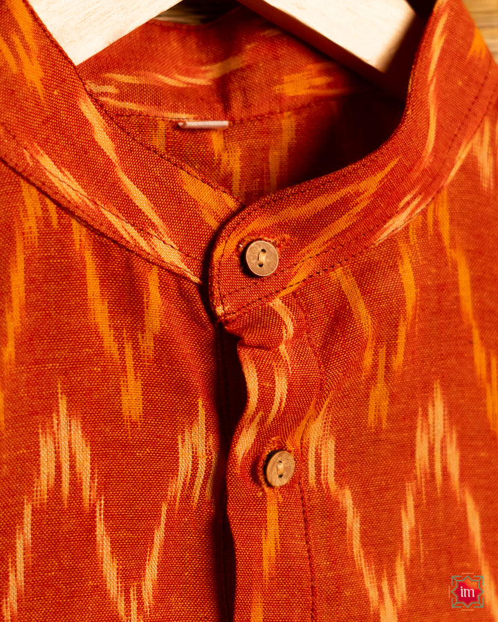 Mens orange kurta , where in the detailed print is displayed.