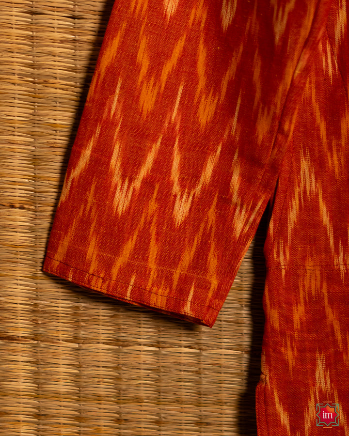 Mens Orange kurta, where in the detailed shoulder side print is displayed.