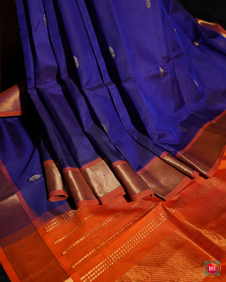 Beautiful Blue Kanchi Silk Saree is pleated and displayed on the floor.