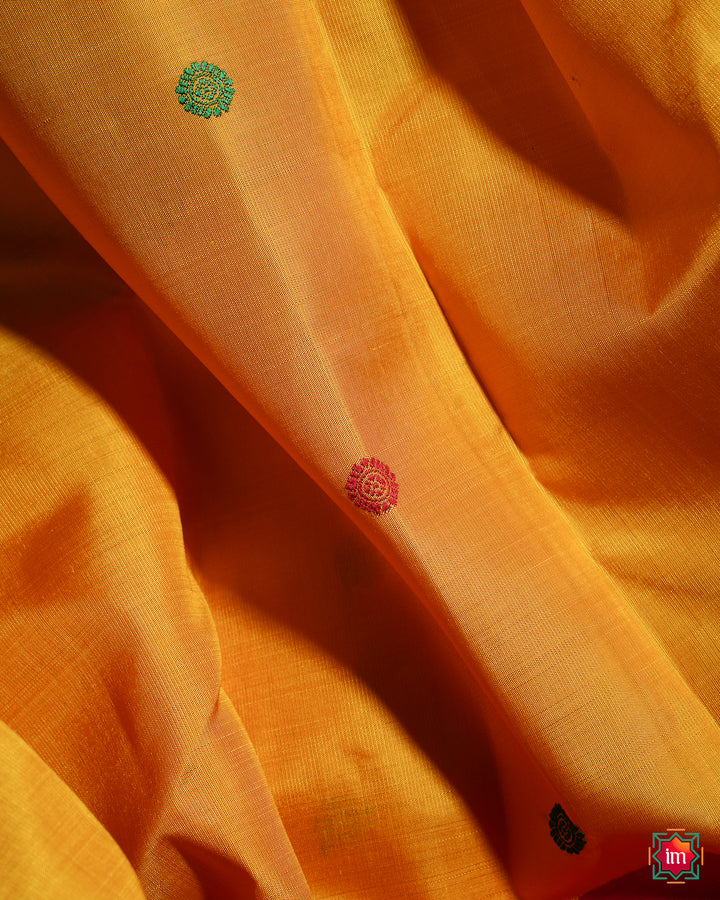 Yellow Red Ganga Jamuna Kanjivaram silk saree, where in the detailed saree print is displayed.