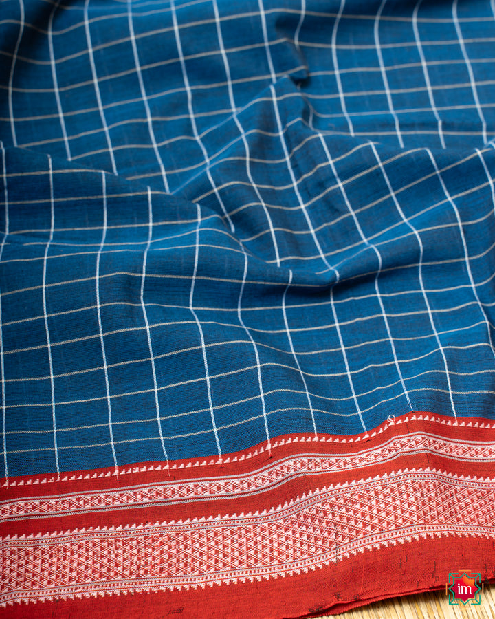 Elegant lake blue handloom cotton saree, where in the detailed saree print is displayed.