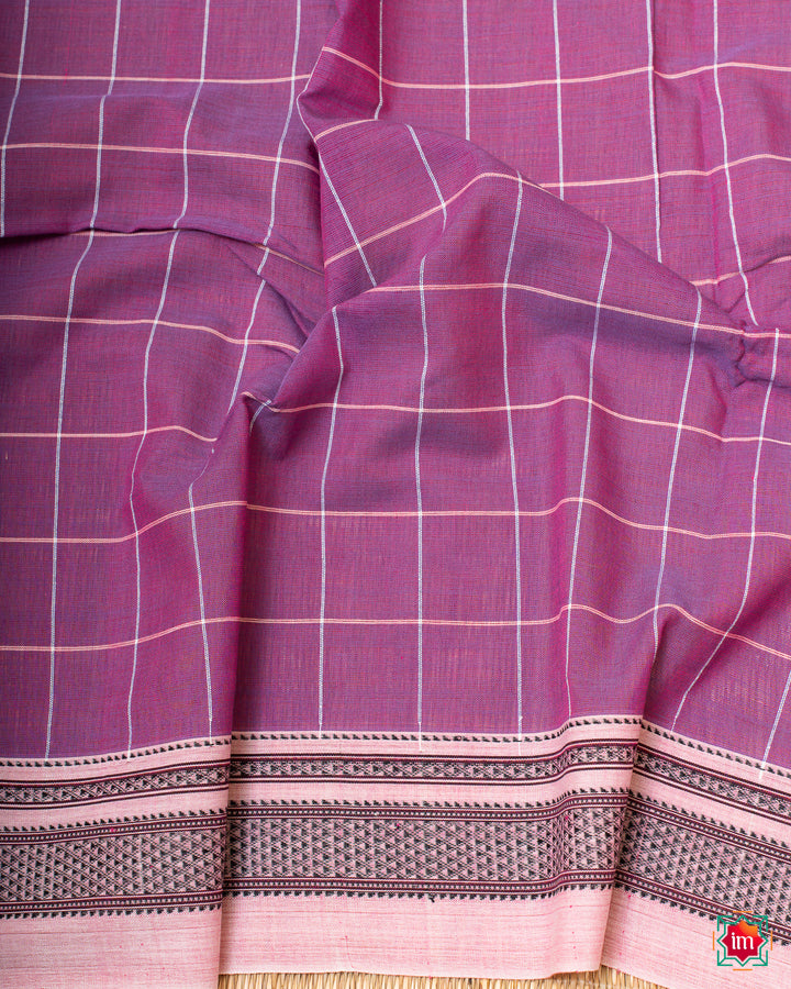 Beautiful orchid purple handloom cotton saree, where in the detailed saree print is displayed.