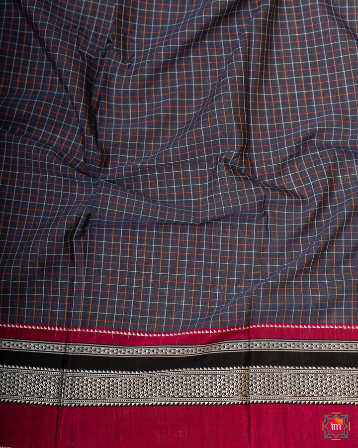 Beautiful blue handloom cotton saree, where in the detailed saree print is displayed.