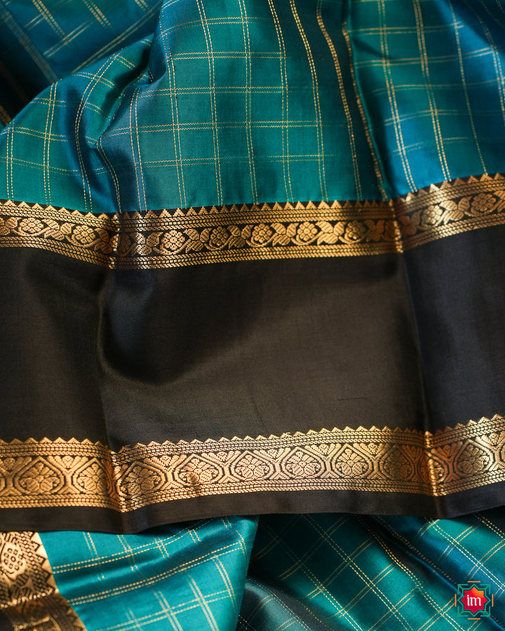 Elegant kanjivaram silk saree is displayed.
