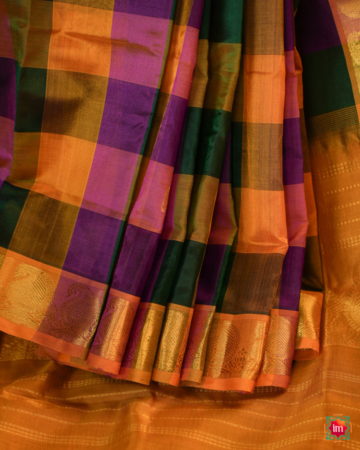 Beautiful Multicolour Palum Pazhamum Kattam Kanchi Saree best handloom saree for women is pleated and displayed on the floor.