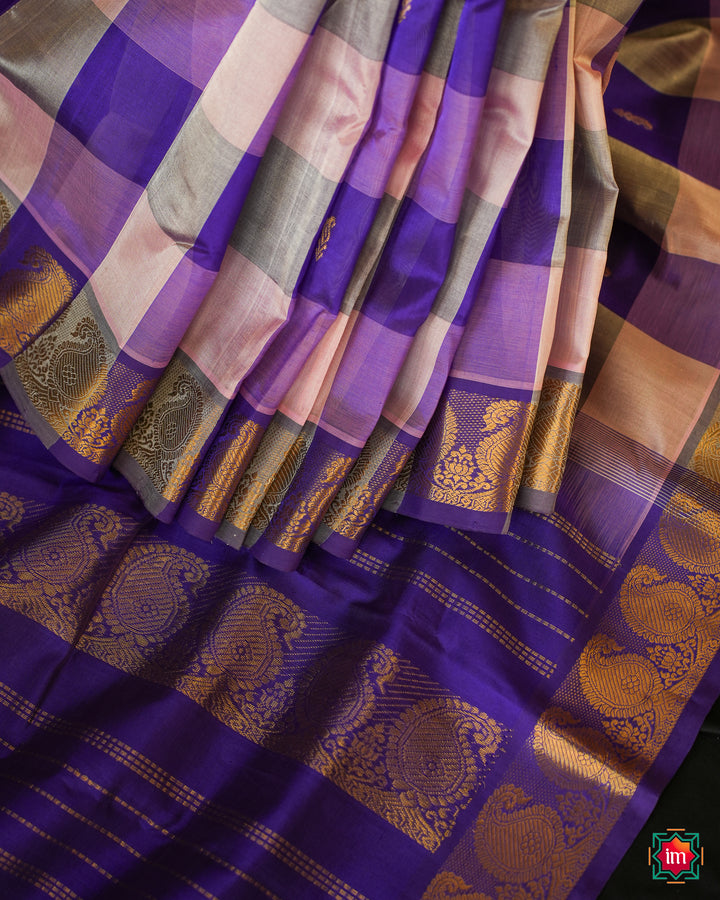 Beautiful Multicolour Kanchi Silk Saree is pleated and displayed on the floor.
