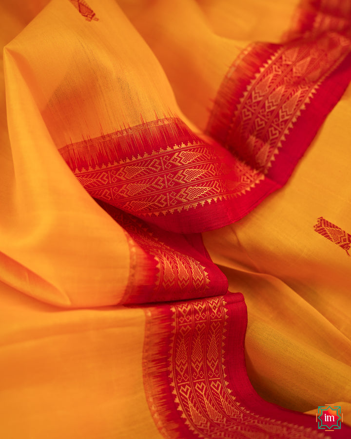 Elegant Yellow Red Khandua Silk Saree Kalyani, where in the detailed saree print is displayed.