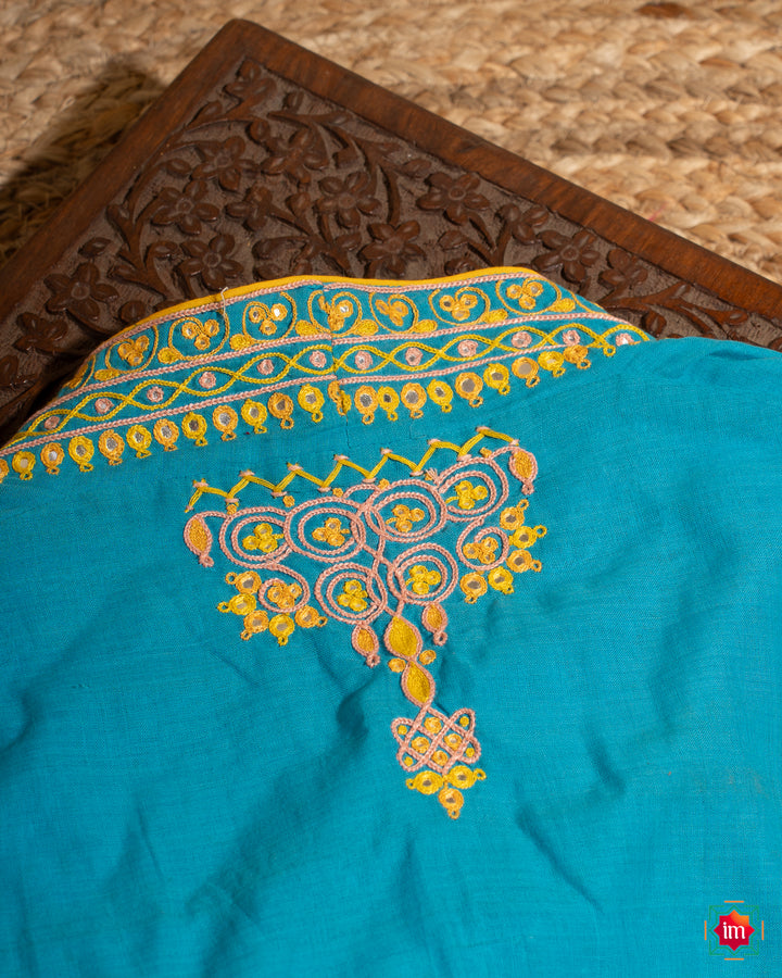 Elegant back side blue embroidery blouse which would suit any silk saree, where in the detailed saree print is displayed.