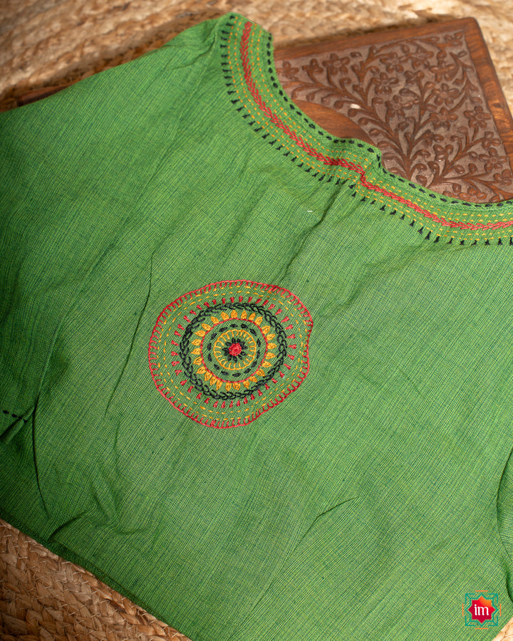 Beautiful back side green embroidery blouse which would suit any silk saree, where in the detailed saree print is displayed.