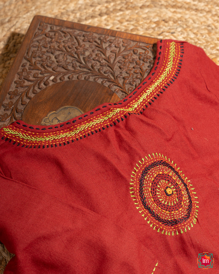 Beautiful back side red embroidery blouse which would suit any silk saree, where in the detailed saree print is displayed.