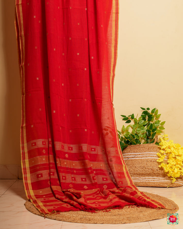 Cherry red handloom saree is displayed.