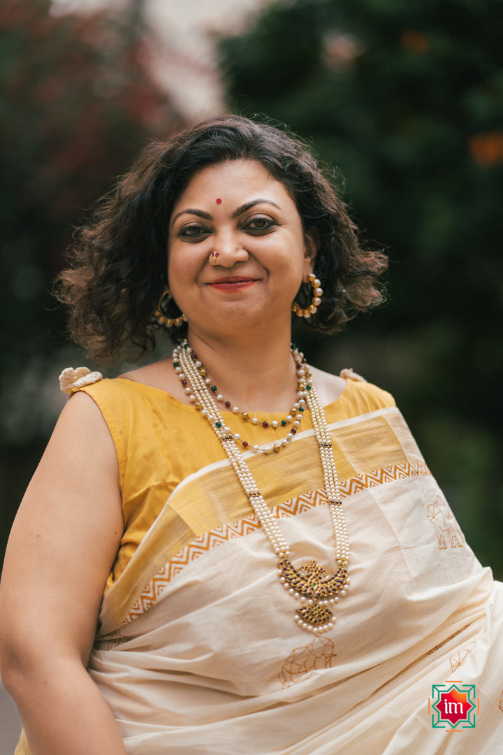 White-Onam-Kasavu-Elephant-Motif-Jugalbandhi-Saree-OruAana-1-The-Indian-motif