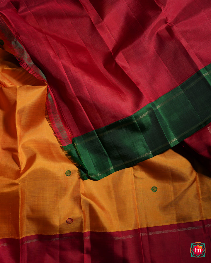 Yellow Red Ganga Jamuna Kanjivaram silk saree, where in the detailed saree print is displayed.